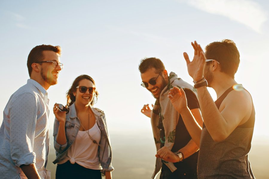 Group of friends laughing outdoors