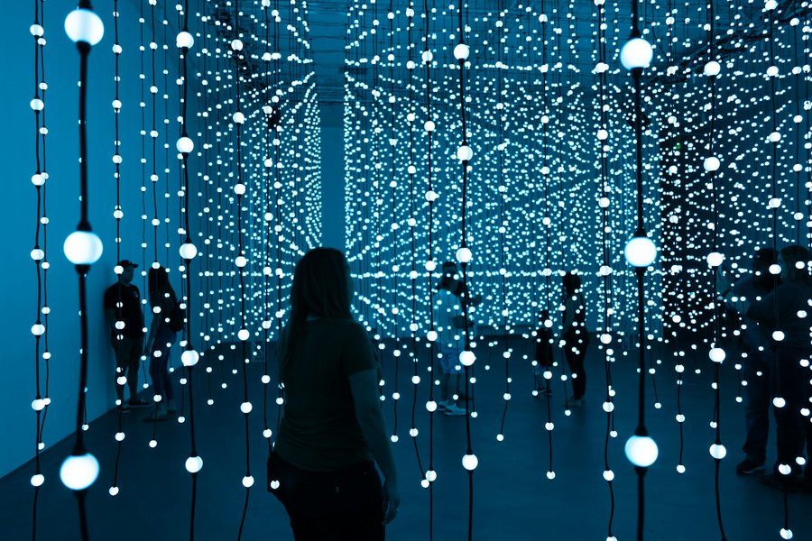 Visitors inside an immersive light installation
