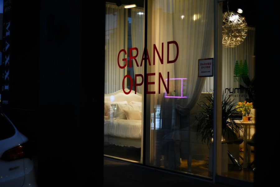 Grand opening sign in a storefront window
