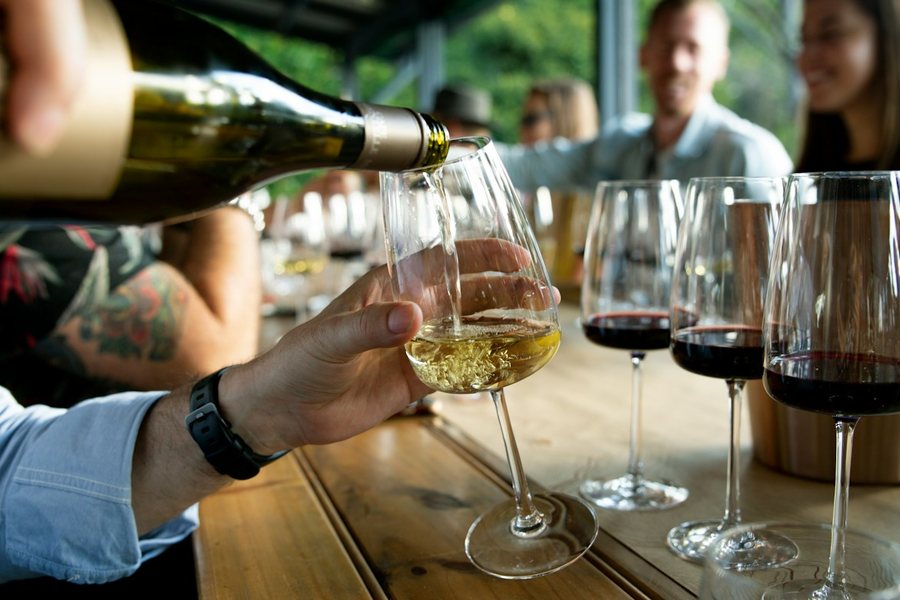 Wine being poured at a tasting event