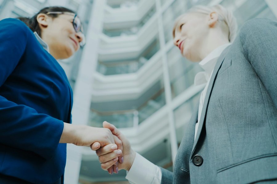 Two businesswomen shaking hands