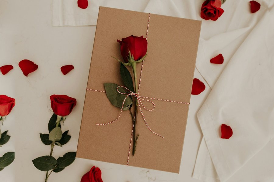 Red rose on a kraft envelope
