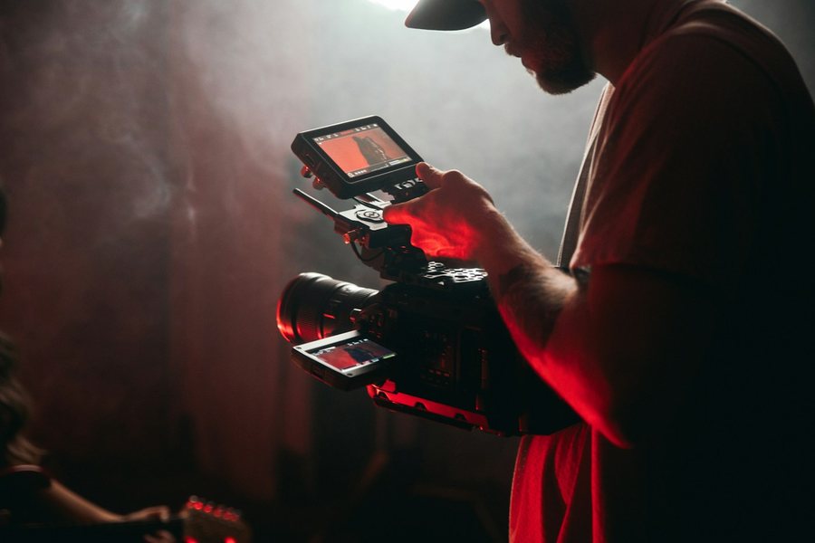 Videographer checking a camera monitor